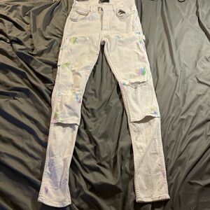 AMIRI White Jeans double knee paint splatter